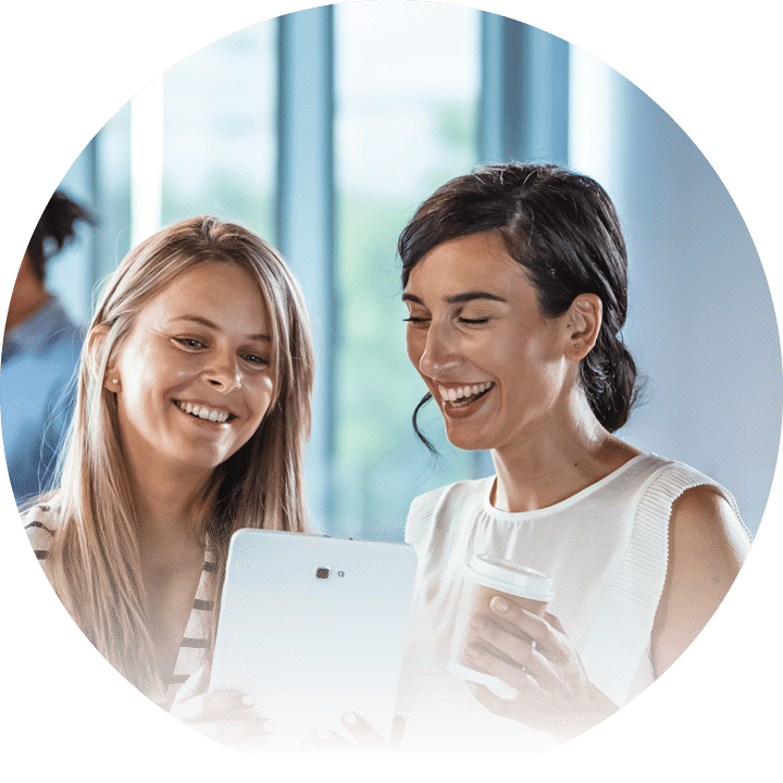 2 women looking at tablet